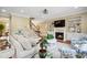 Comfortable living room with fireplace, open staircase, hardwood floors, and stylish decor at 220 Lakecroft Pl, Fuquay Varina, NC 27526