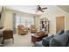 Cozy living room with armchairs, natural light and inviting atmosphere for relaxation and entertainment with TV at 220 Lakecroft Pl, Fuquay Varina, NC 27526