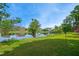 Picturesque pond reflecting the sky and surrounding homes, enhancing the community's appeal at 220 Lakecroft Pl, Fuquay Varina, NC 27526