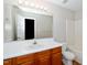 Practical bathroom with a vanity, sink, a large mirror, and a toilet at 2253 Violet Bluff Ct, Raleigh, NC 27610