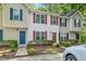 Charming townhouse exterior with colorful shutters and well-maintained landscaping at 2253 Violet Bluff Ct, Raleigh, NC 27610