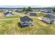 An aerial view of the neighborhood showcasing houses and the open field and trees at 234 Robert Howe Dr, Fuquay Varina, NC 27526