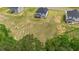 An aerial view of the backyard, showing the screen porch and surrounding land at 234 Robert Howe Dr, Fuquay Varina, NC 27526