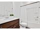 Bathroom features a single sink vanity, large mirror, shower with curtain, and vinyl flooring at 234 Robert Howe Dr, Fuquay Varina, NC 27526