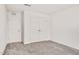 Bedroom featuring neutral carpet, and closets with double doors and single door at 234 Robert Howe Dr, Fuquay Varina, NC 27526