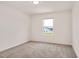 This bedroom features neutral carpet, one window letting in plenty of natural light at 234 Robert Howe Dr, Fuquay Varina, NC 27526