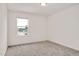 This bedroom features neutral carpet, one window letting in plenty of natural light at 234 Robert Howe Dr, Fuquay Varina, NC 27526
