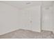 Bedroom featuring neutral carpet, and two doors for storing personal items at 234 Robert Howe Dr, Fuquay Varina, NC 27526