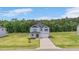 Charming two-story home featuring a well maintained front yard with green trees in background at 234 Robert Howe Dr, Fuquay Varina, NC 27526