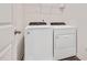 Laundry room features Whirlpool washer and dryer, vinyl flooring, and storage shelves at 234 Robert Howe Dr, Fuquay Varina, NC 27526