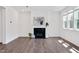 Spacious living room featuring fireplace, hardwood floors and lots of natural light at 234 Robert Howe Dr, Fuquay Varina, NC 27526