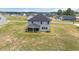An aerial view of the backyard featuring a screened porch and surrounding land at 234 Robert Howe Dr, Fuquay Varina, NC 27526