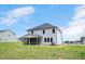 A spacious backyard featuring a screened porch connected to a two story home at 234 Robert Howe Dr, Fuquay Varina, NC 27526