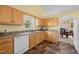 Kitchen with tile floors, window over the sink, and a view into the eat-in dining area at 2424 Cambridge Rd, Burlington, NC 27215