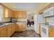 Cozy eat-in kitchen with tile floors and cabinets with white appliances at 2424 Cambridge Rd, Burlington, NC 27215