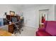 Office with a desk, black computer monitor, rolling chair, and white walls at 2424 Cambridge Rd, Burlington, NC 27215