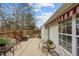 Exterior of home with patio, awning, outdoor furniture and landscaped yard at 2424 Cambridge Rd, Burlington, NC 27215