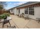 Exterior of home with patio, awning, outdoor furniture and landscaped yard at 2424 Cambridge Rd, Burlington, NC 27215