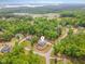 Aerial view of a lovely home in a wooded neighborhood near a school at 251 Gentry Dr, Pittsboro, NC 27312