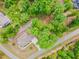 Aerial view of a beautiful home surrounded by lush trees and green landscaping at 251 Gentry Dr, Pittsboro, NC 27312