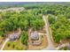 Aerial view of a lovely home in a wooded neighborhood near a school at 251 Gentry Dr, Pittsboro, NC 27312