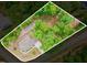 Aerial view of a beautiful home surrounded by lush trees on a well-defined lot at 251 Gentry Dr, Pittsboro, NC 27312