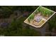 Aerial view of home and lot in a secluded wooded neighborhood at 251 Gentry Dr, Pittsboro, NC 27312