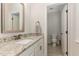 Bathroom featuring granite countertops, white cabinets, and a neutral color palette, offering a clean and modern design at 251 Gentry Dr, Pittsboro, NC 27312