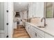 Modern kitchen features white cabinets, stainless steel appliances, and sleek countertops at 251 Gentry Dr, Pittsboro, NC 27312