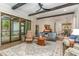 Bright living room featuring hardwood floors, beamed ceilings, and neutral decor at 251 Gentry Dr, Pittsboro, NC 27312