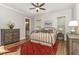 Serene main bedroom with wood-look accent wall and ensuite bathroom at 251 Gentry Dr, Pittsboro, NC 27312
