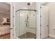 Modern shower features glass enclosure, bench seat, and dual shower heads at 251 Gentry Dr, Pittsboro, NC 27312