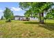 A sprawling lawn provides ample space for outdoor activities and relaxation at 2710 E Greensboro Chapel Hill Rd, Snow Camp, NC 27349