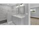 Modern bathroom with marble tile shower, double sink vanity and updated fixtures at 2710 E Greensboro Chapel Hill Rd, Snow Camp, NC 27349