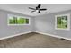 Serene bedroom with new flooring and ample natural light from dual windows at 2710 E Greensboro Chapel Hill Rd, Snow Camp, NC 27349