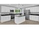 Modern kitchen with granite countertops, stainless steel appliances, and white cabinetry at 2710 E Greensboro Chapel Hill Rd, Snow Camp, NC 27349