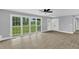 Bright living room with large windows and new floors, perfect for entertaining at 2710 E Greensboro Chapel Hill Rd, Snow Camp, NC 27349