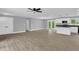 Spacious living room boasts new floors, neutral paint, and modern ceiling fan at 2710 E Greensboro Chapel Hill Rd, Snow Camp, NC 27349