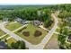 Aerial view showcases homes with expansive lawns and elegant landscaping at 30 Futrell Ridge Ct, Chapel Hill, NC 27517
