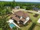 Aerial view of the beautiful home with a backyard pool, landscaped yard and community at 30 Futrell Ridge Ct, Chapel Hill, NC 27517