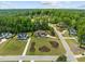 Aerial view of a home featuring a manicured lawn, beautiful landscaping, and neighborhood at 30 Futrell Ridge Ct, Chapel Hill, NC 27517