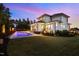 Gorgeous home exterior with pristine pool, manicured lawn, and lush landscaping at 30 Futrell Ridge Ct, Chapel Hill, NC 27517