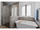 Luxurious bathroom featuring a soaking tub, glass-enclosed shower, and modern fixtures at 30 Futrell Ridge Ct, Chapel Hill, NC 27517
