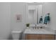 Well-lit bathroom with stylish vanity, framed mirror, and modern fixtures at 30 Futrell Ridge Ct, Chapel Hill, NC 27517