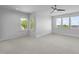 Bright, spacious bedroom with a ceiling fan and large windows offering scenic views at 30 Futrell Ridge Ct, Chapel Hill, NC 27517