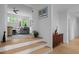 Inviting entryway with light wood steps leading to a view of a cozy living space at 30 Futrell Ridge Ct, Chapel Hill, NC 27517