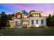 Modern two-story home with stone accents, covered porch, and manicured front lawn at 30 Futrell Ridge Ct, Chapel Hill, NC 27517