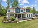 Beautiful two-story home with a manicured lawn and stone accents on the facade at 30 Futrell Ridge Ct, Chapel Hill, NC 27517