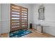 Elegant foyer with hardwood floors, modern table, stylish decor and a view of the front yard at 30 Futrell Ridge Ct, Chapel Hill, NC 27517