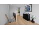 Hallway with wood floors, a staircase, and decorative accents, leading to other areas of the home at 30 Futrell Ridge Ct, Chapel Hill, NC 27517